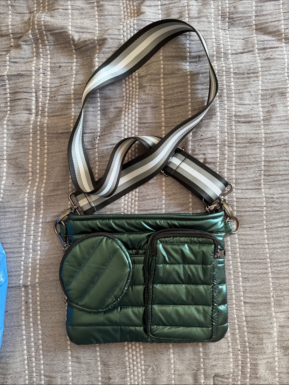 THINK ROYLN Quilted Puffer Crossbody in Shiny Dark Green with Striped Strap